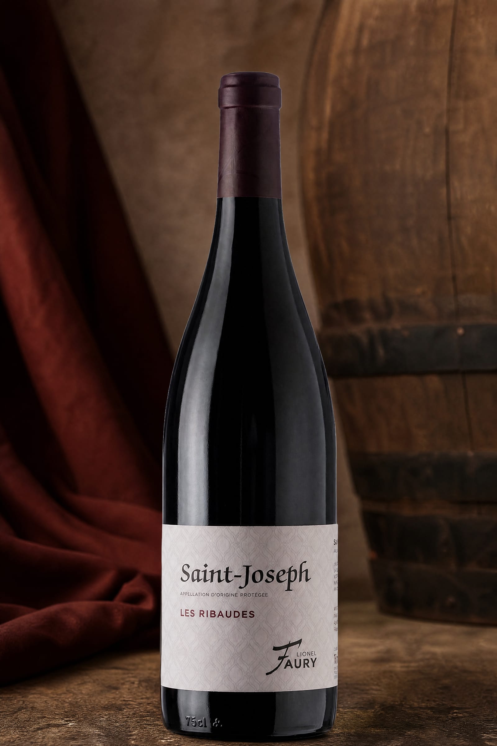 Studio bottle portrait of Domaine Lionel Faury Saint-Joseph Rouge Les Ribaudes on a cream backdrop